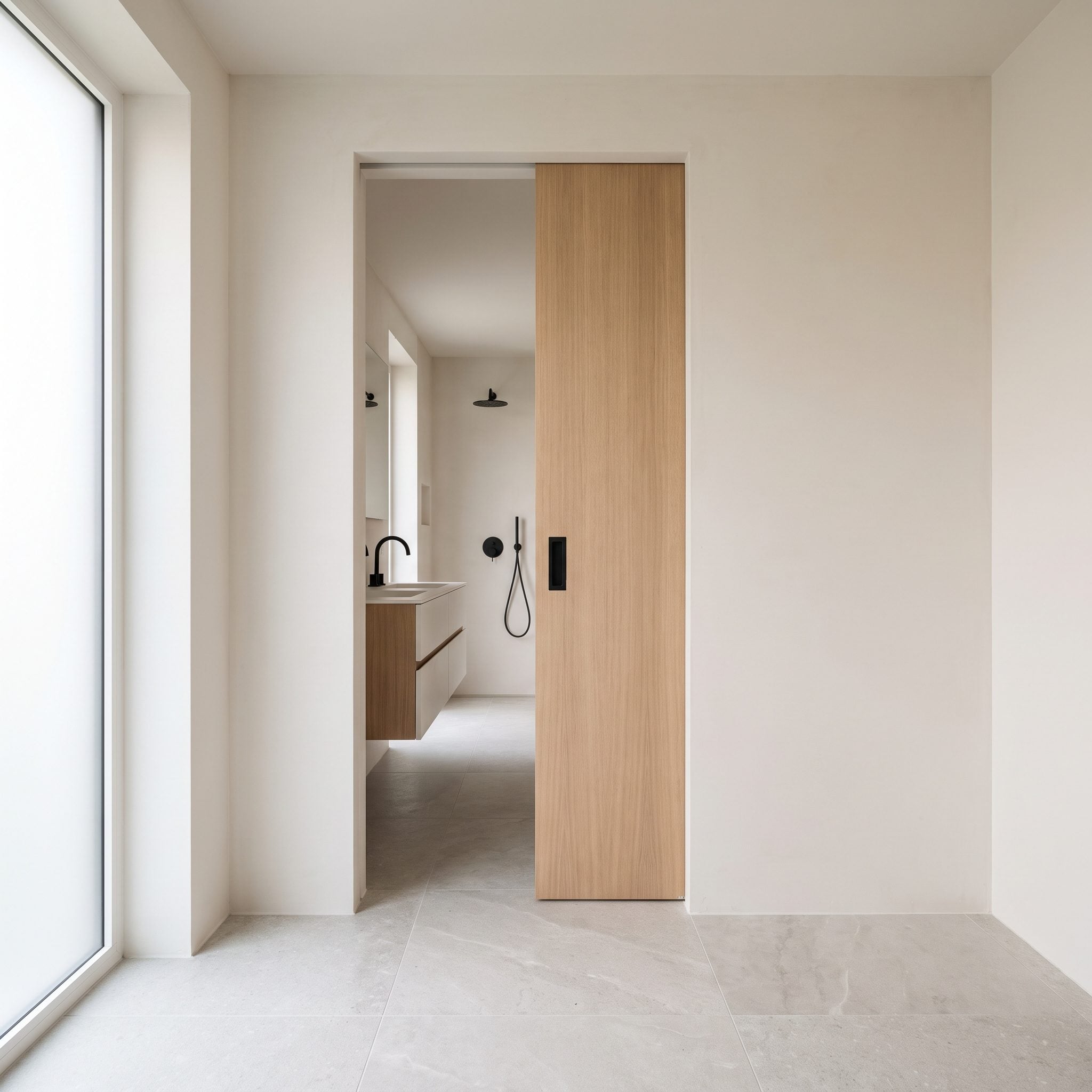 Bathroom with a pocket door sliding into the wall instead of swinging across the floor