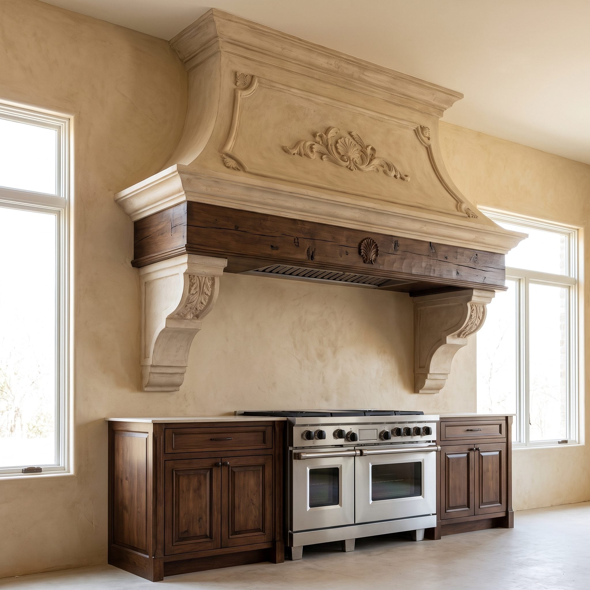 Kitchen renovation replacing a bulky decorative range hood with a streamlined stainless-steel canopy