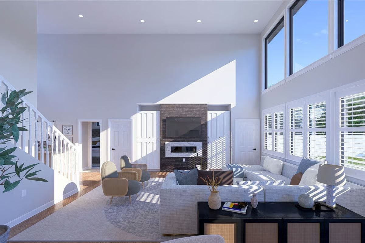Clerestory Light and a Brick Fireplace Wall Anchor the Double-Height Living Room