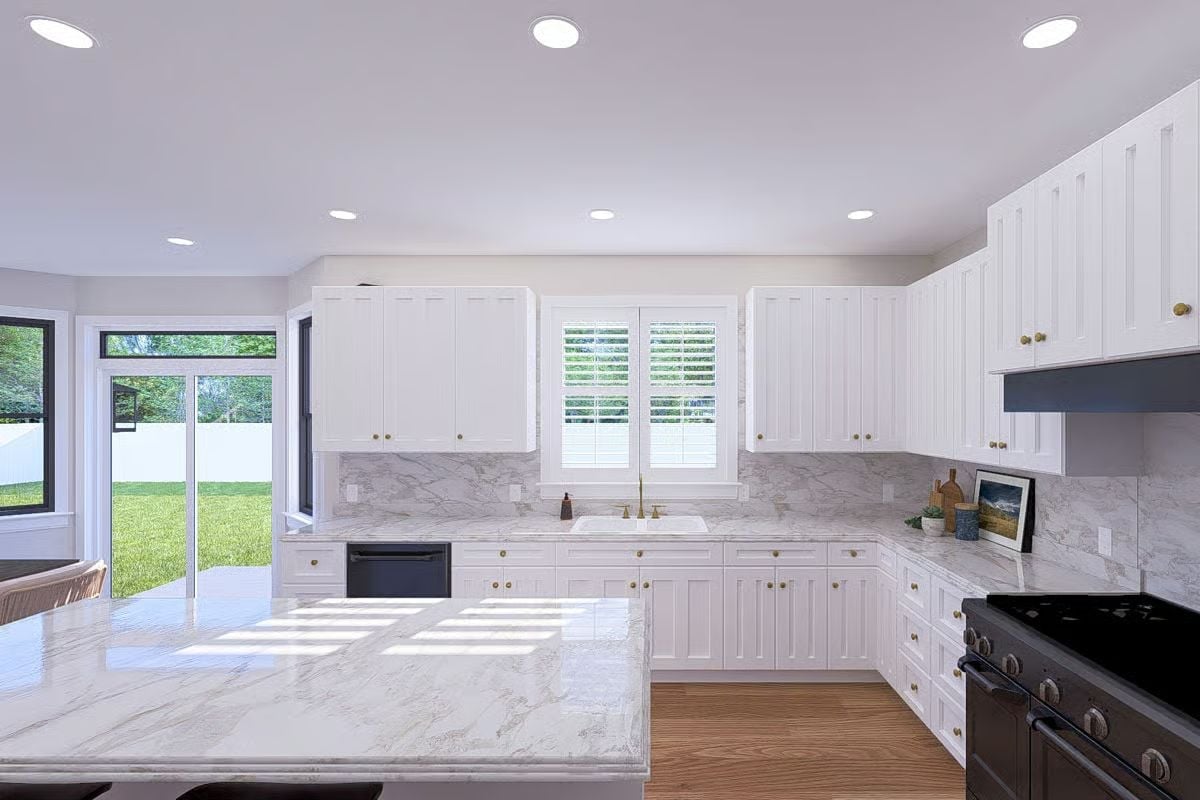Marble Countertops and Brass Hardware Pull Off a Kitchen That Doesn't Try Too Hard