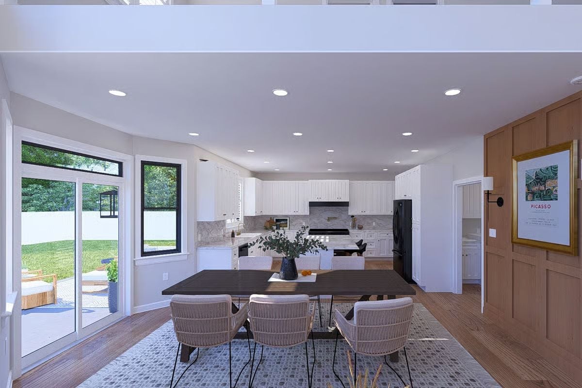 Open-Plan Dining and Kitchen With Sliding Glass Access to the Backyard Patio