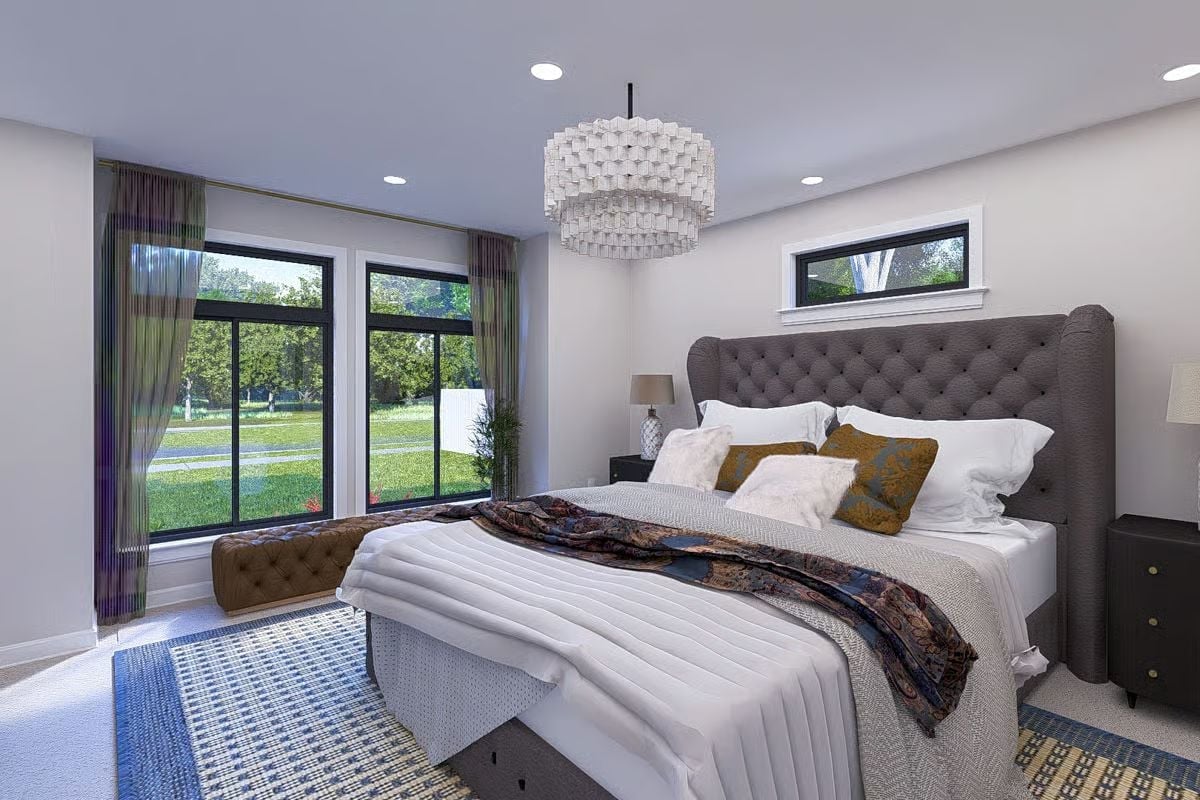 Tufted Wingback Headboard and a Tiered Chandelier Set the Tone for the Primary Suite
