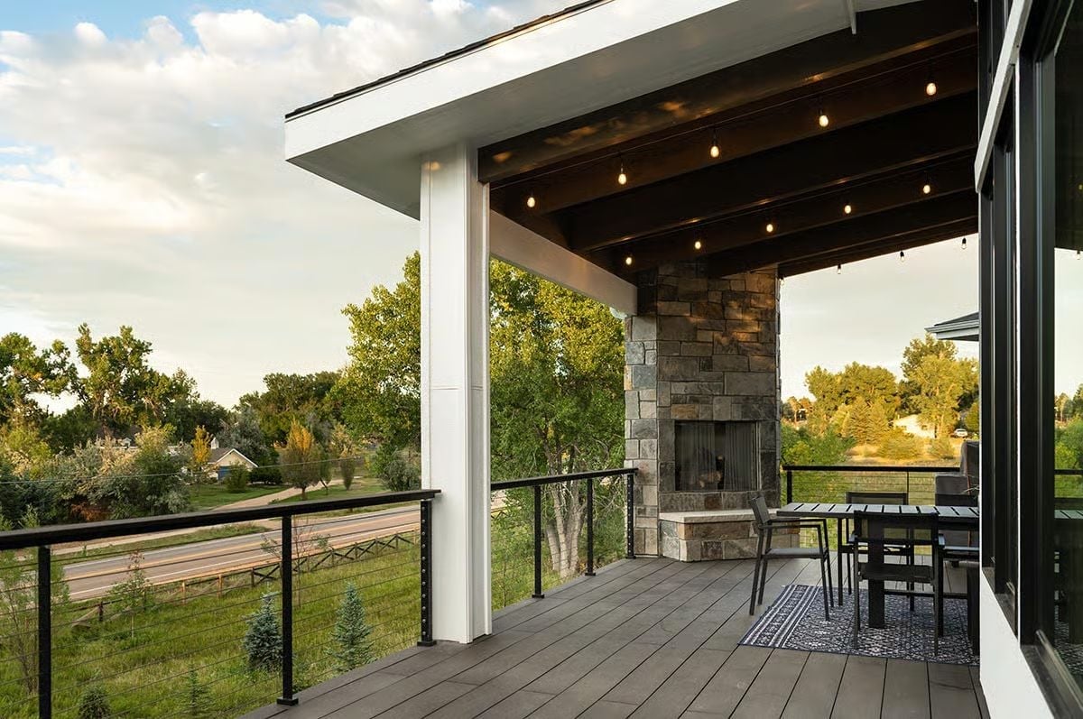 Stone Fireplace on a Second-Story Deck That Didn't Have to Try This Hard