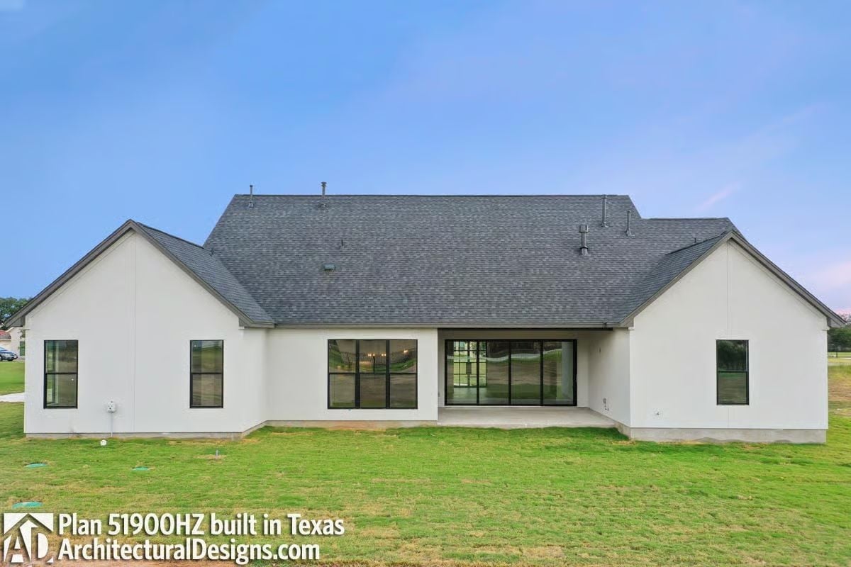 White Stucco Rear Elevation Where Glass Does the Heavy Lifting
