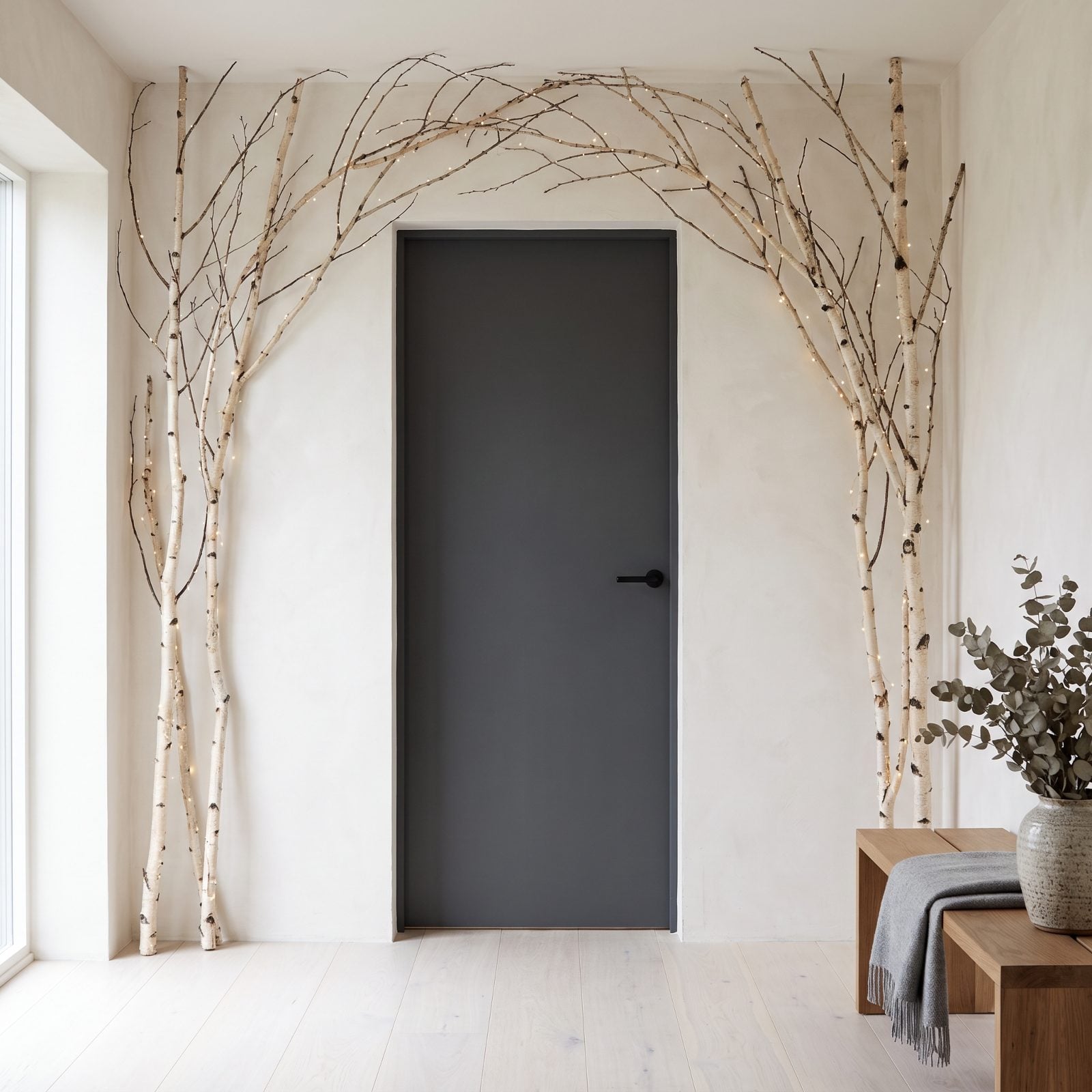 Bare Birch Branches Arched Over the Door