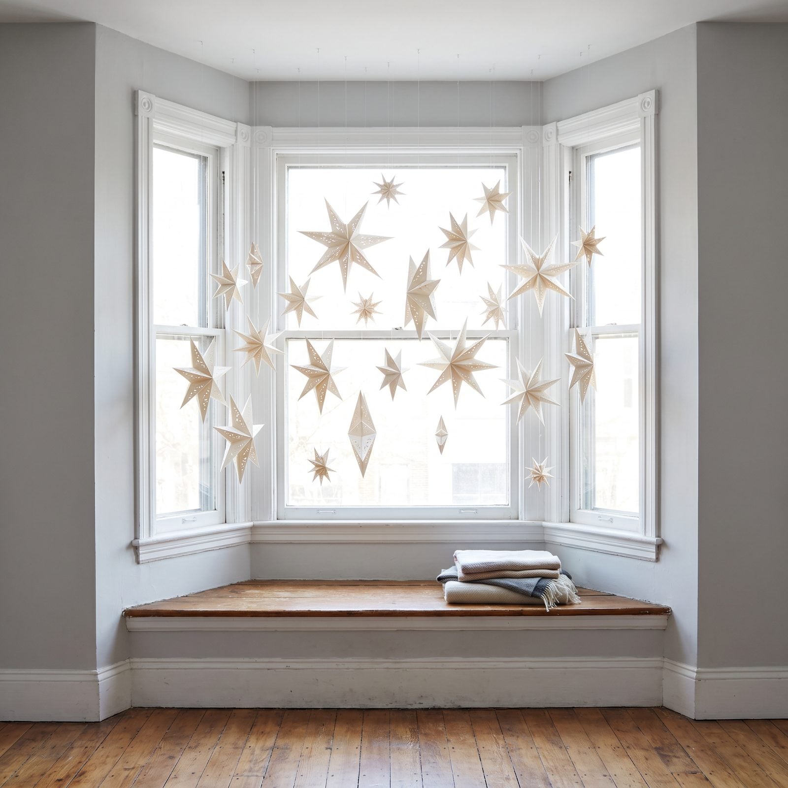 A Bay Window Hung With Suspended Paper Stars