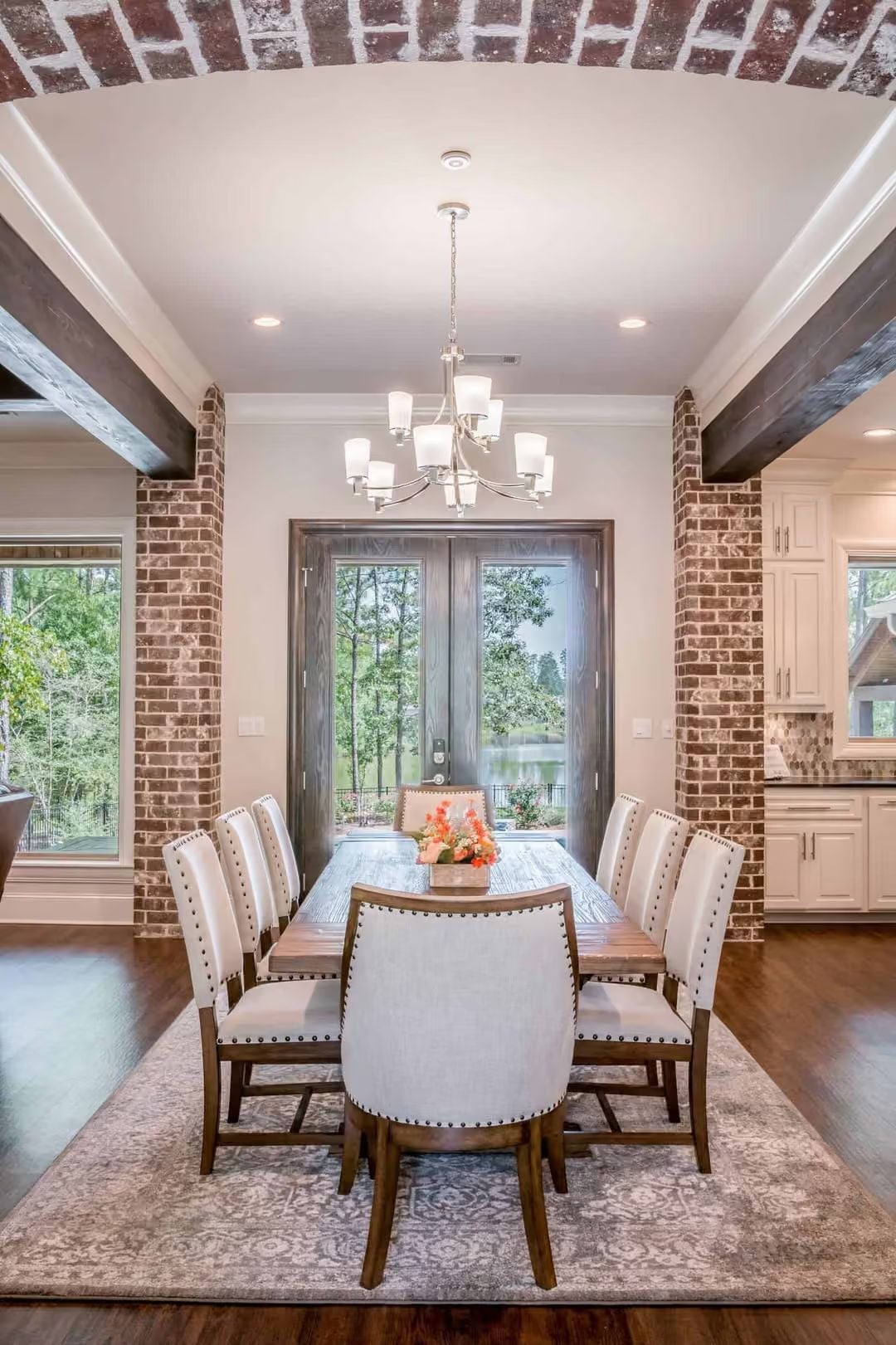 Nailhead Chairs and a Water View Make Every Dinner Feel Like an Event