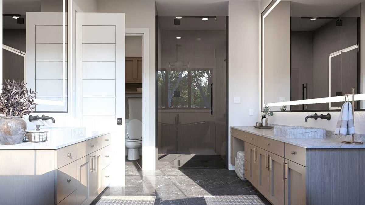 Dual Vanities on Opposite Walls and a Glass Shower That Earns Its Square Footage