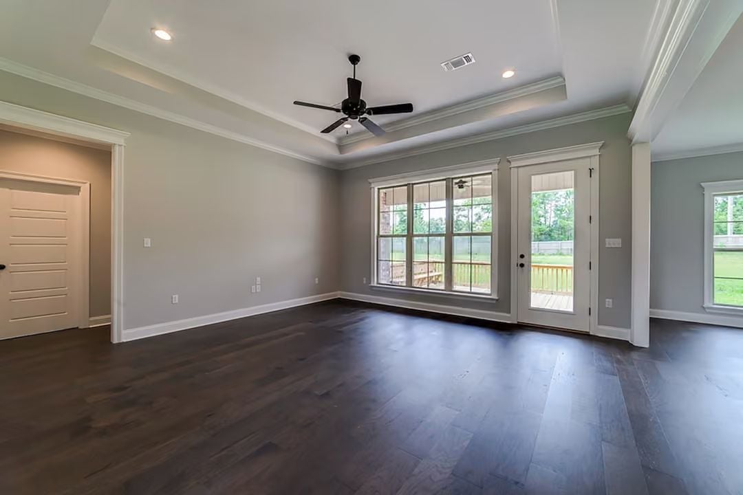 Dark Hardwood and a Tray Ceiling That Actually Earns Its Keep