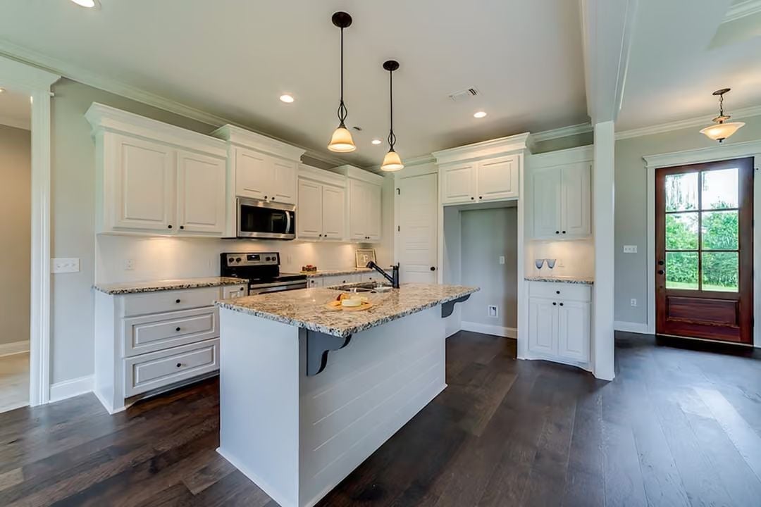 Granite Island, Pendant Lights, and Cabinets That Don't Try Too Hard