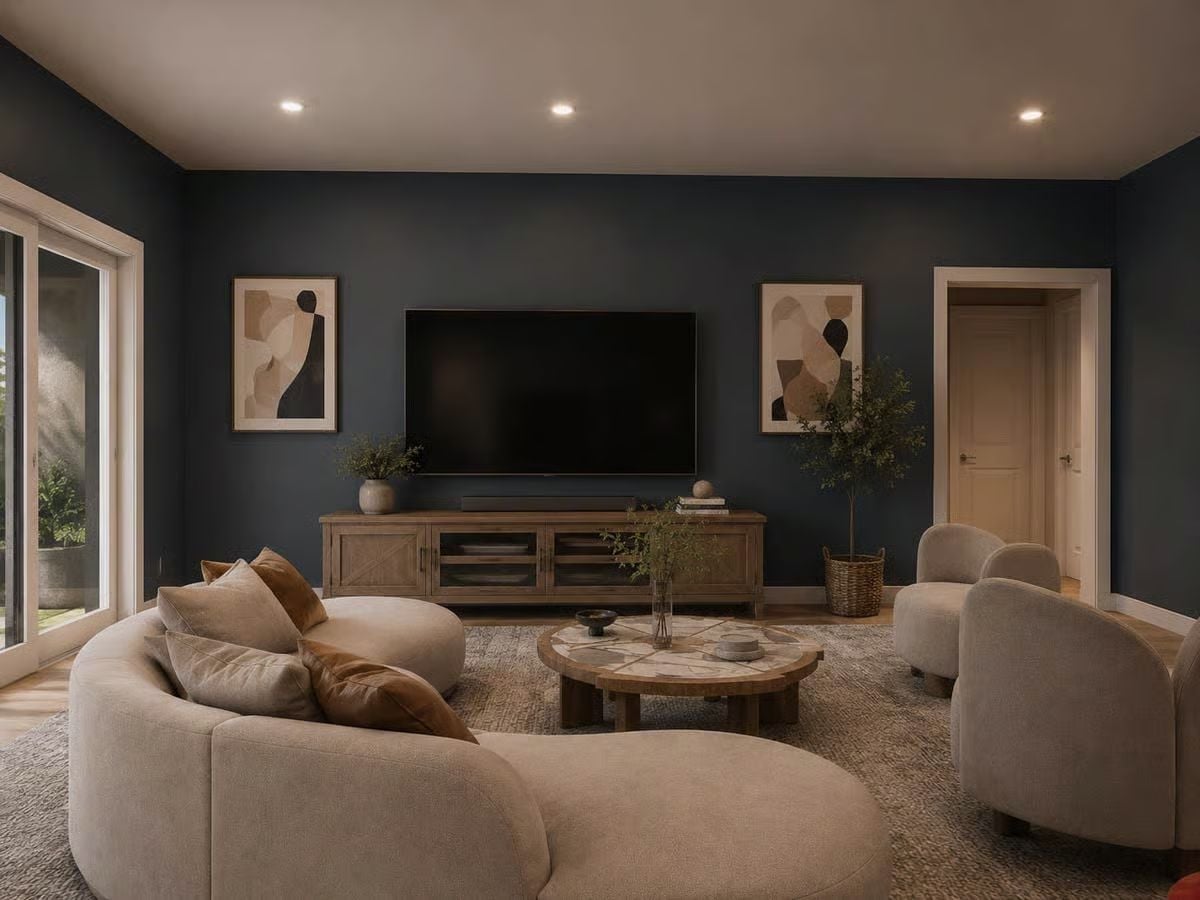 Curved Sectional, Dark Walls, and a TV Wall That Doesn't Apologize for Itself