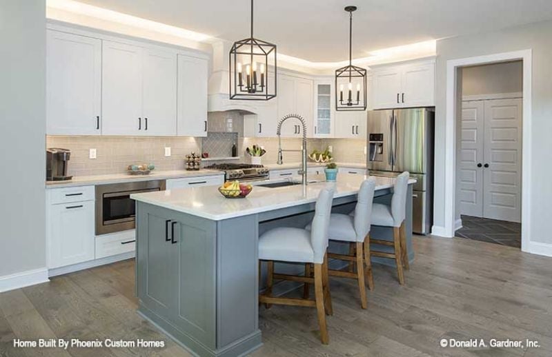 Lantern Pendants, a Slate-Blue Island, and Counter Seating That Actually Works