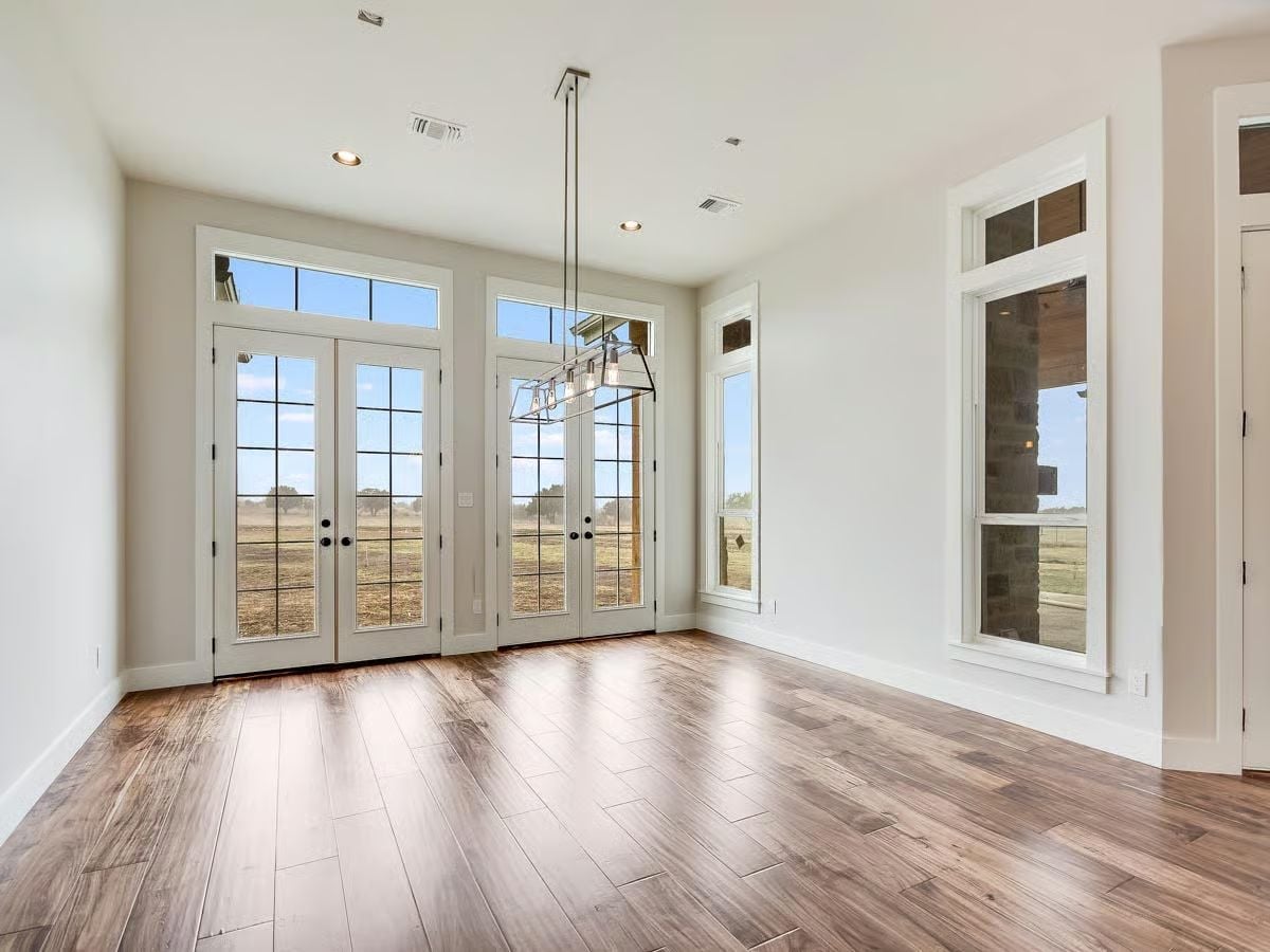 French Doors Facing Open Pasture Turn Natural Light Into the Main Event