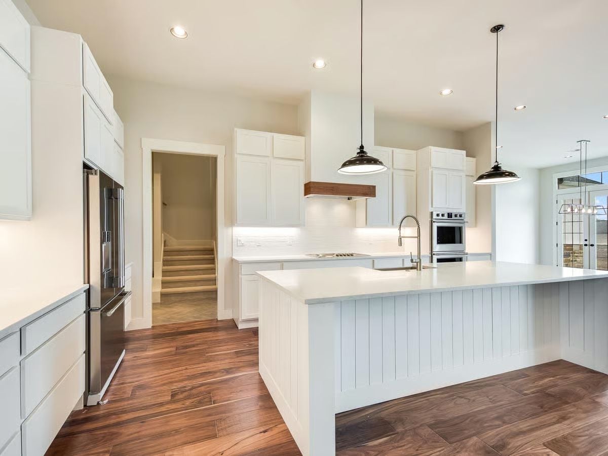 Shiplap Island Skirt and Walnut Floors Make the White Cabinetry Work Harder