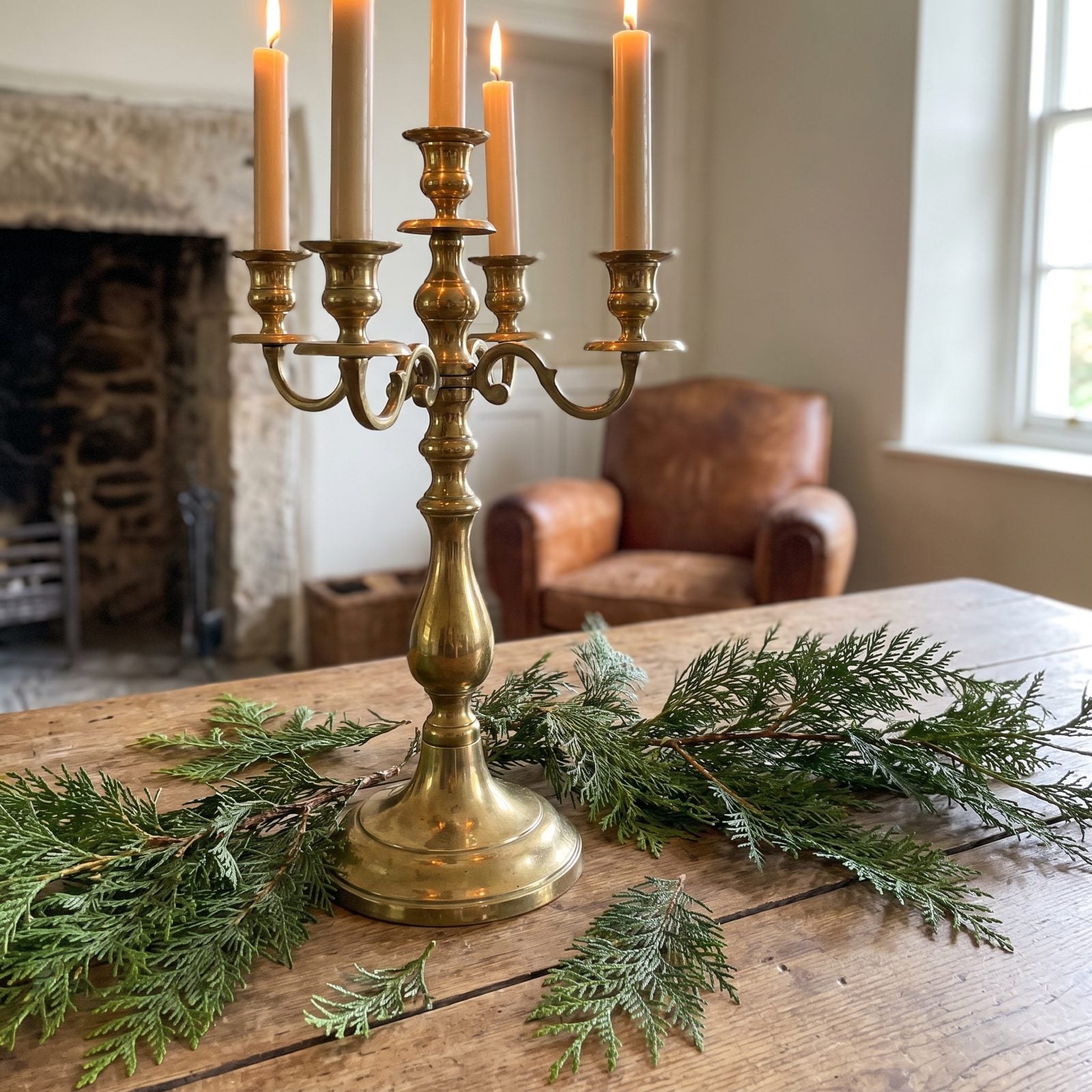 A Brass Candelabra Surrounded by Loose Cedar Tips