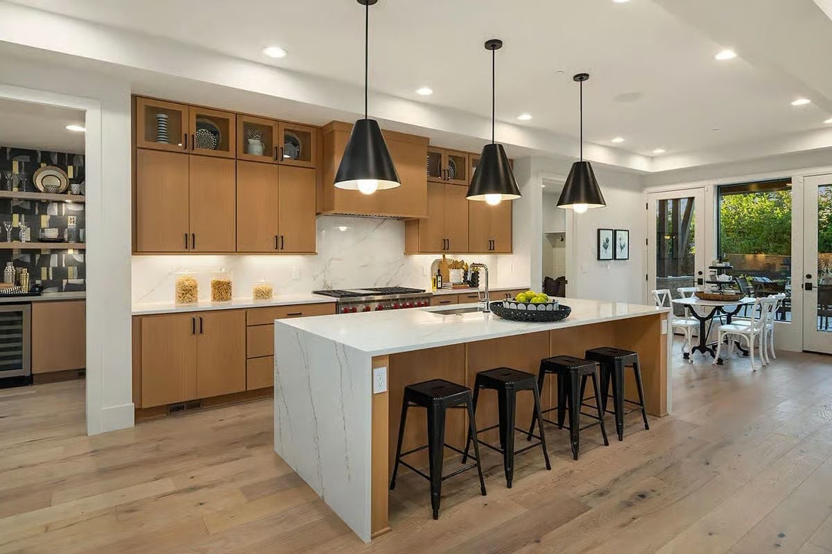 Warm Wood Cabinets Doing the Heavy Lifting in This Open Kitchen