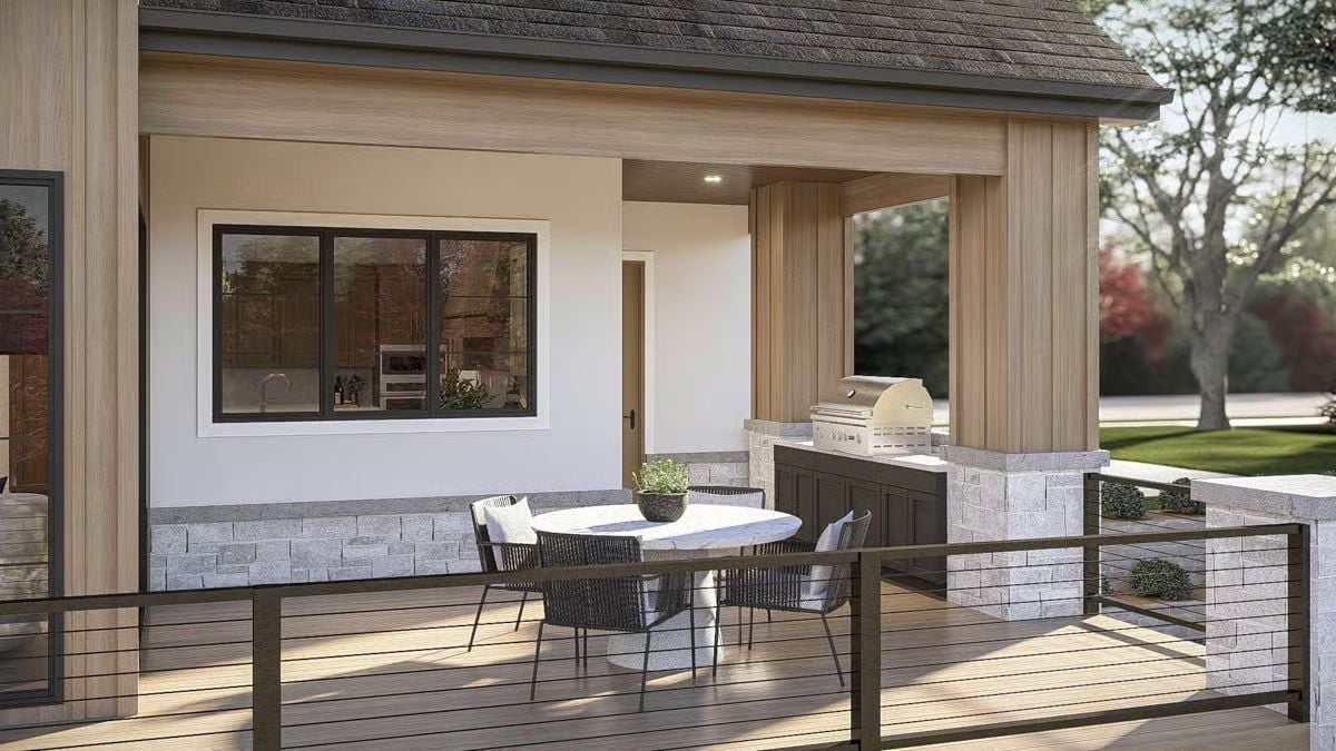 Covered Outdoor Kitchen With Stone Counters and a Built-In Grill Worth Taking Seriously