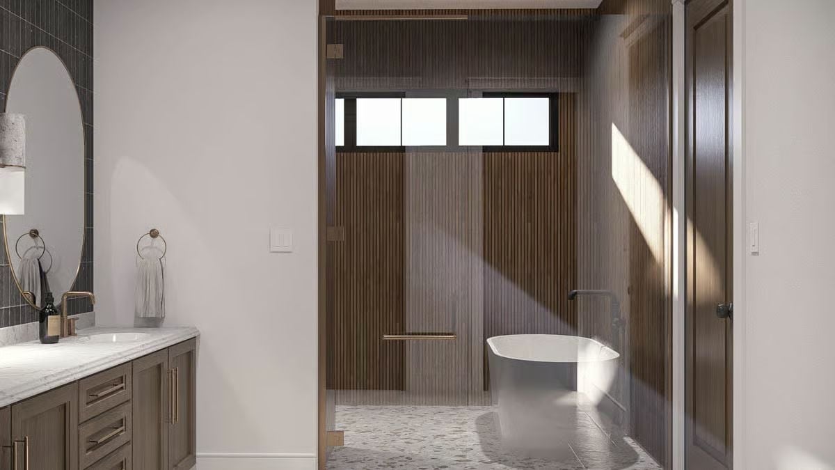 Fluted Wood Walls and a Soaking Tub Tucked Behind Glass Do the Heavy Lifting Here