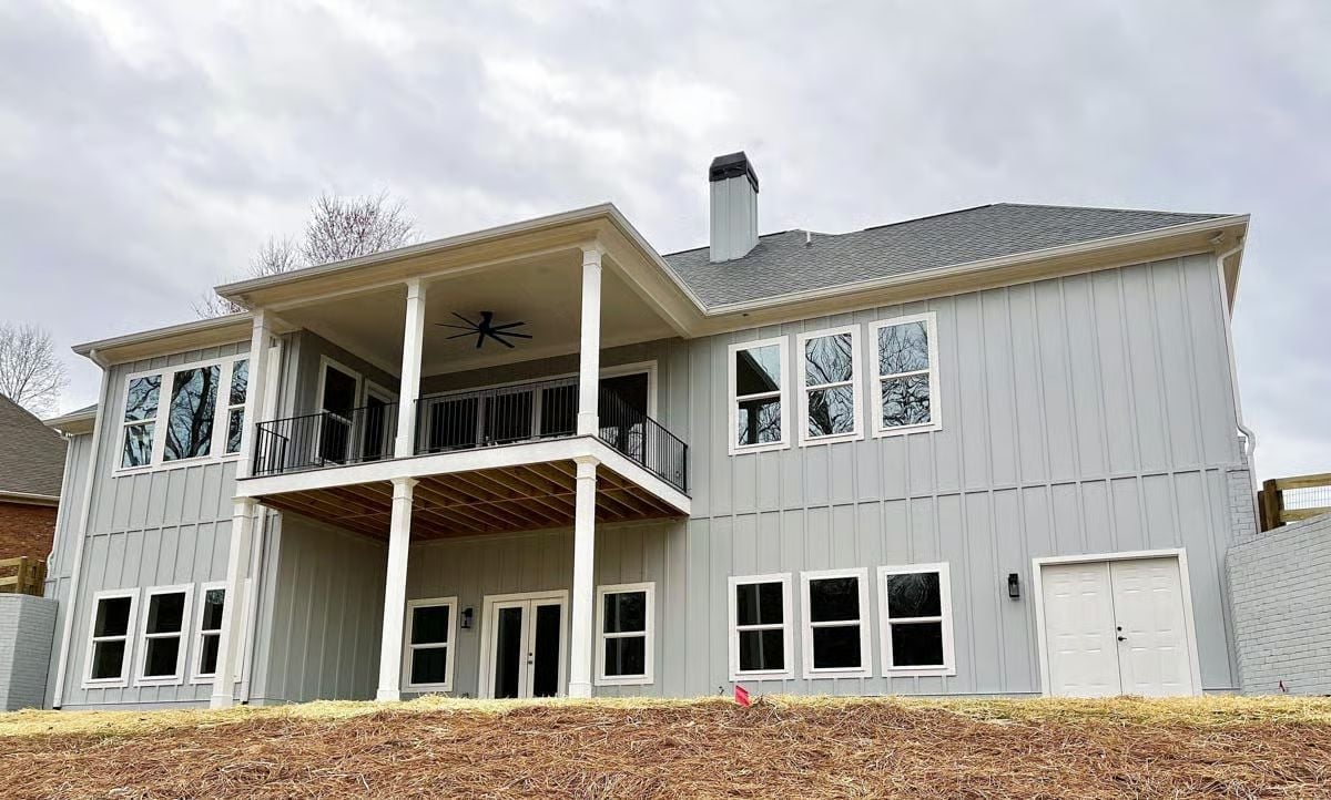 Board-and-Batten Rear Elevation Built to Handle a Sloped Lot