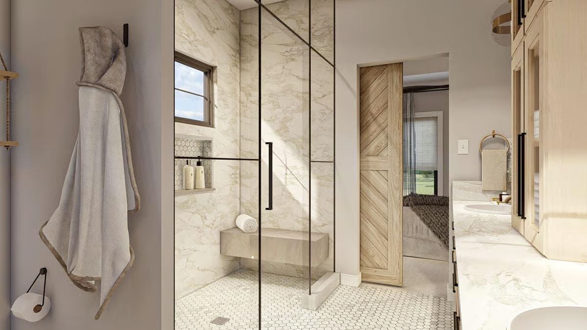 Marble Shower With a Bench, a Barn Door, and Zero Apologies