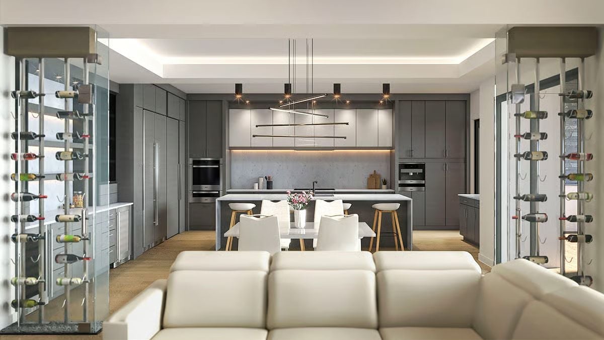 Wine Columns Flanking an Open Kitchen Signal Priorities From the First Step In