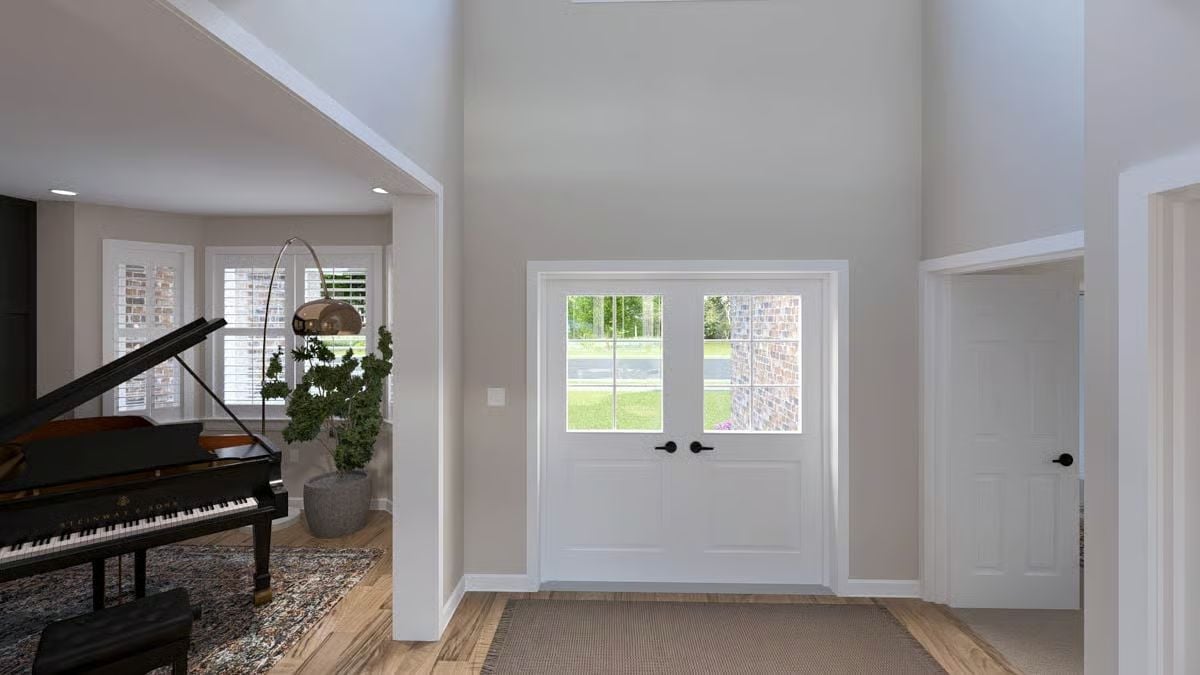 Grand Entry Foyer with Soaring Ceilings Makes a Case for the Piano Room Next Door