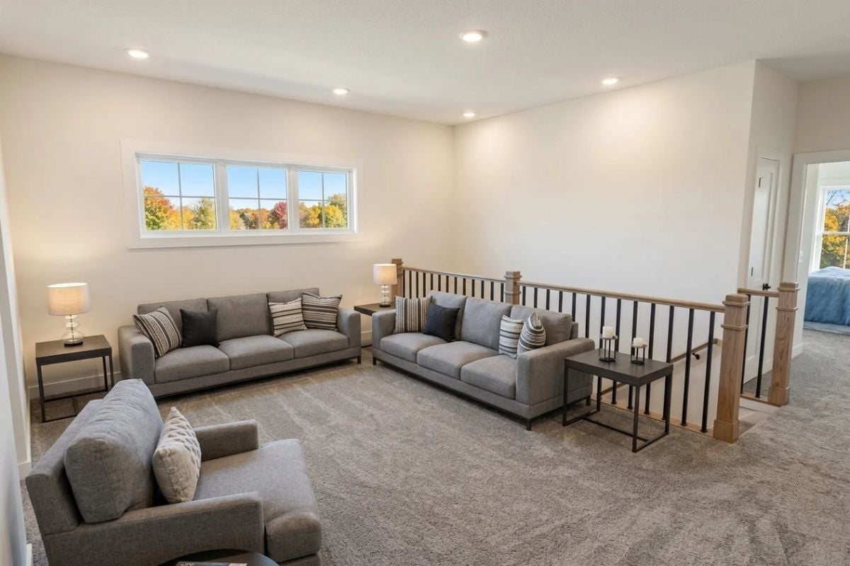 Upper-Level Loft With Staircase Railing That Earns Its Keep as a Design Element