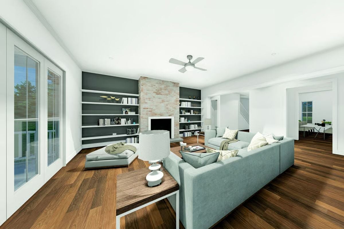 Sage Sofas, Brick Fireplace, and Built-Ins That Handle the Book Collection