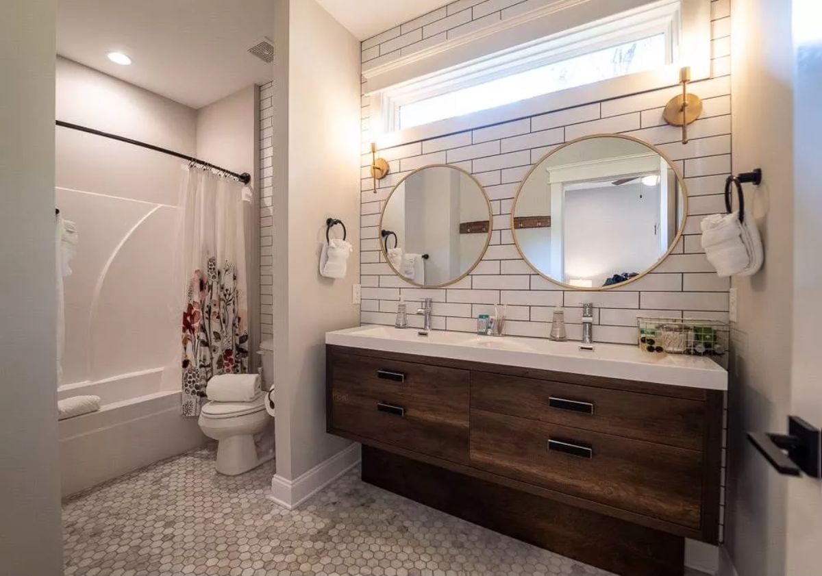 Double Round Mirrors and a Floating Vanity That Pull the Whole Room Together