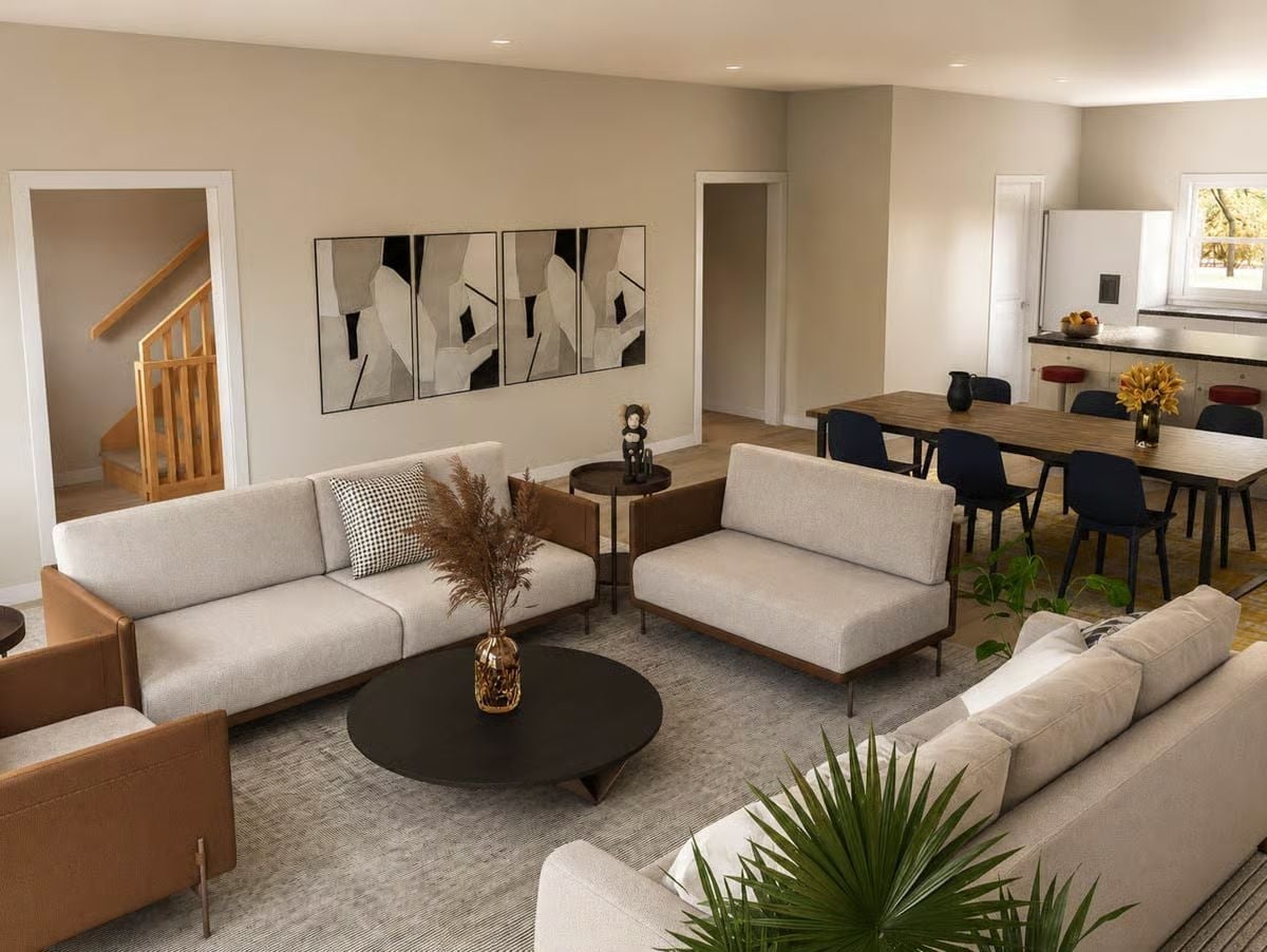 Cream Linen Sofas and a Round Black Coffee Table Ground This Open Living Space