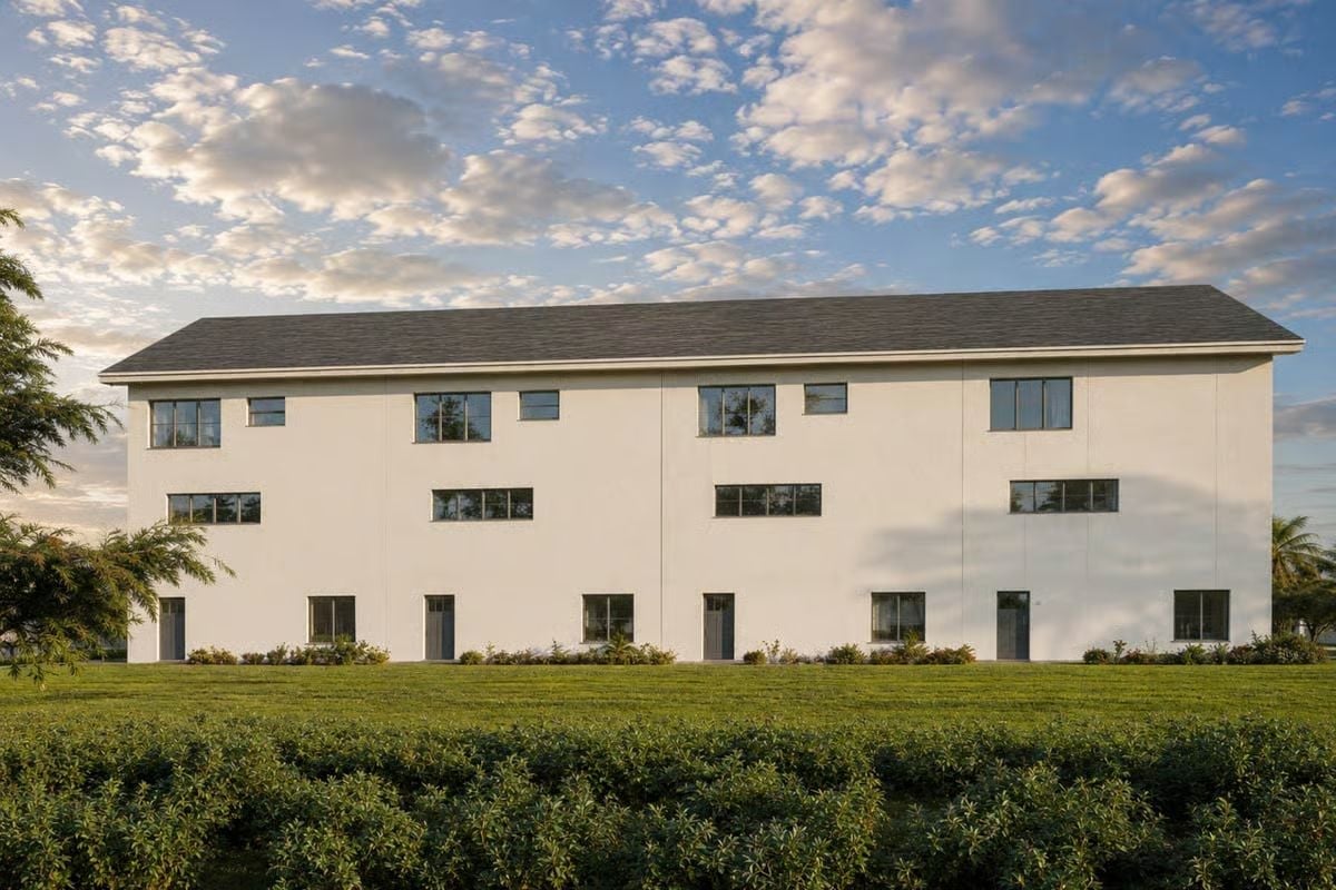 Crisp White Stucco Meets Investor-Grade Restraint on This Quadplex Rear Elevation