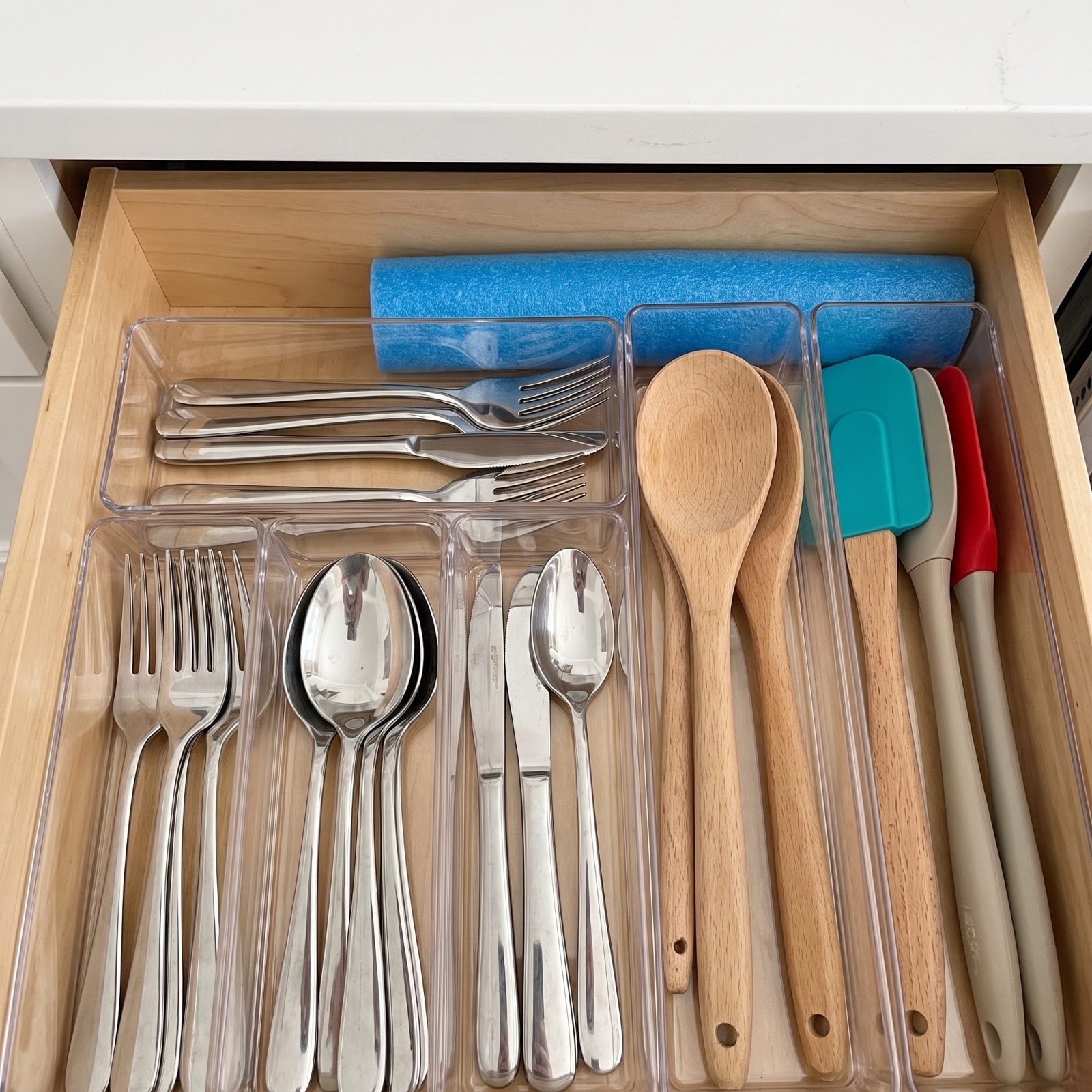 A Chunk of Pool Noodle Stops Drawer Organizers From Sliding