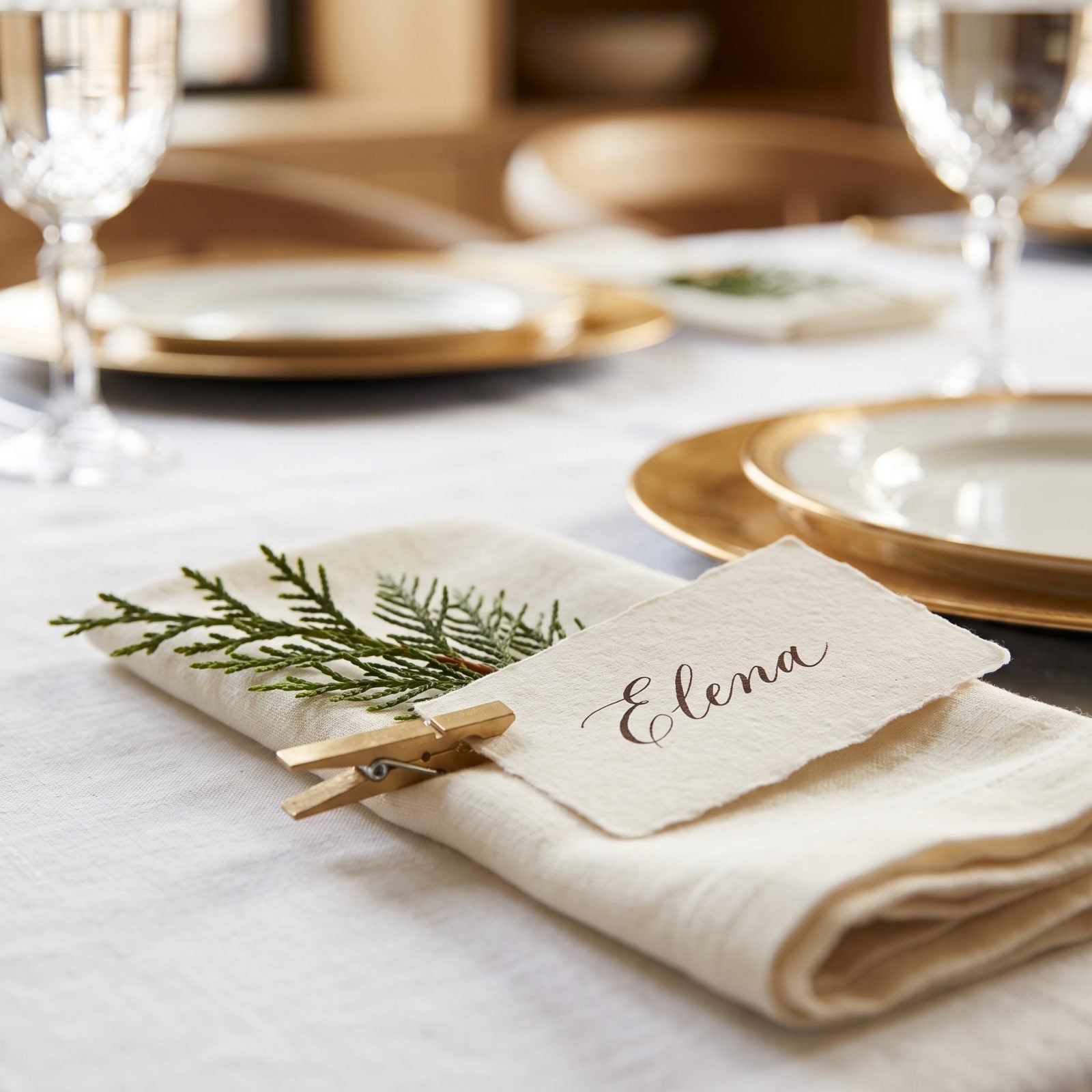 Clip Handwritten Place Cards to Evergreen Sprigs