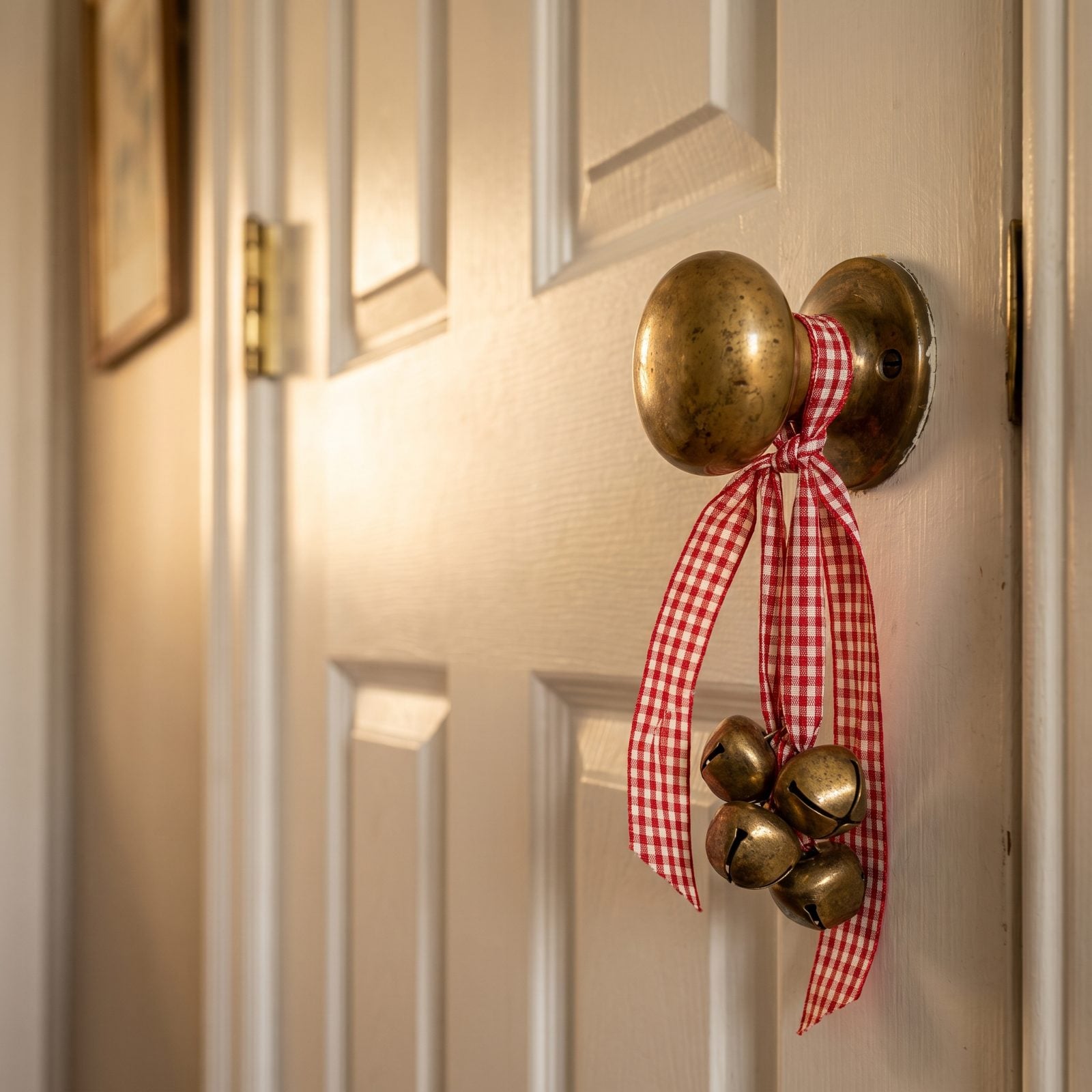 A Cluster of Jingle Bells on an Interior Doorknob