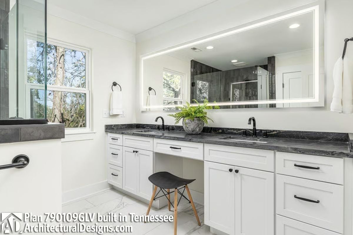 Backlit Mirror, Dark Granite, and a Vanity Stool That Knows Its Job
