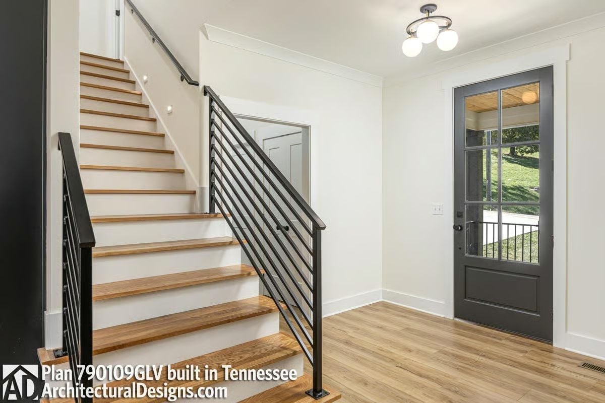 Horizontal Steel Rails Give This Staircase a Backbone Worth Noticing