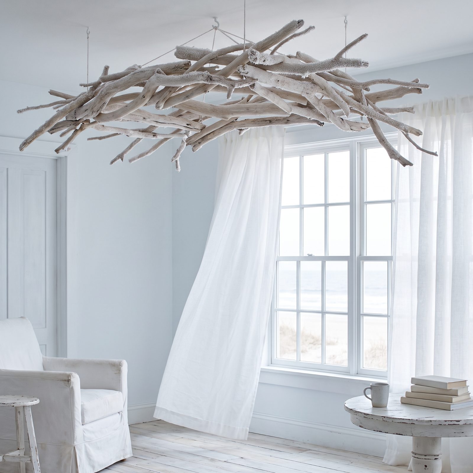 A Coastal Room Beneath a Canopy of Frosted Driftwood