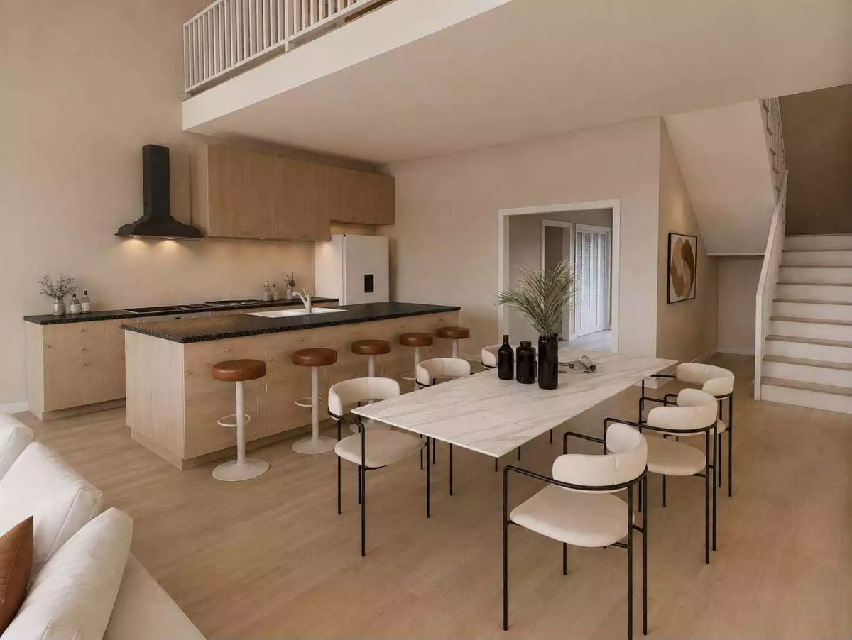 Kitchen Island With a Dark Granite Top Pulls Double Duty as a Prep Zone and Casual Bar