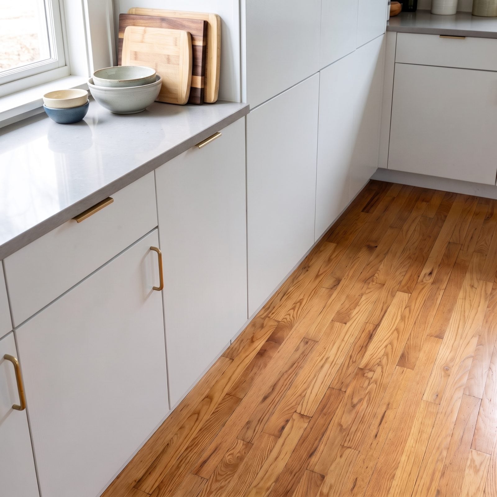 Cool White Cabinets Clashing With Honey Oak Floors