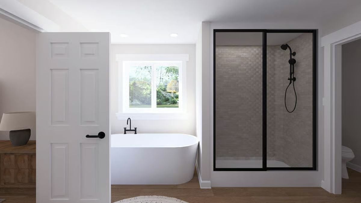 Freestanding Tub Positioned Under a Window Is the Oldest Trick in the Book. It Still Works.