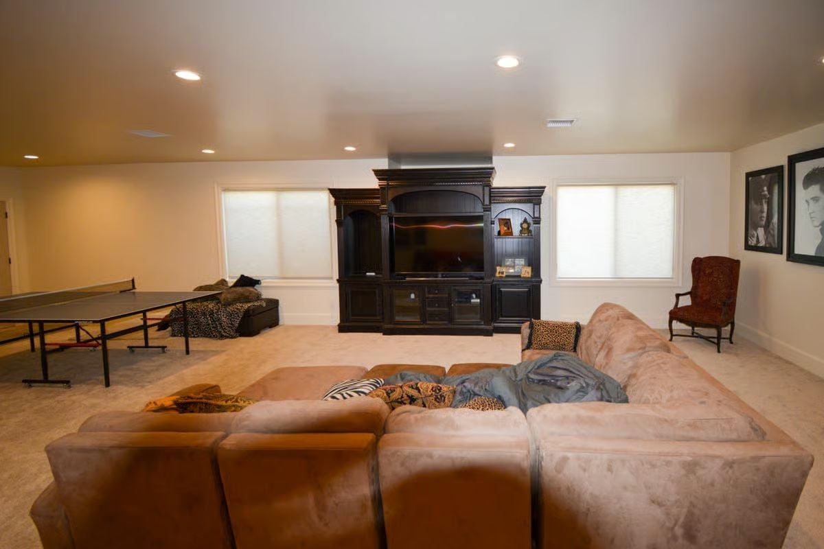 Ping-Pong on One Side, Sectional on the Other, and a TV Wall Doing Double Duty