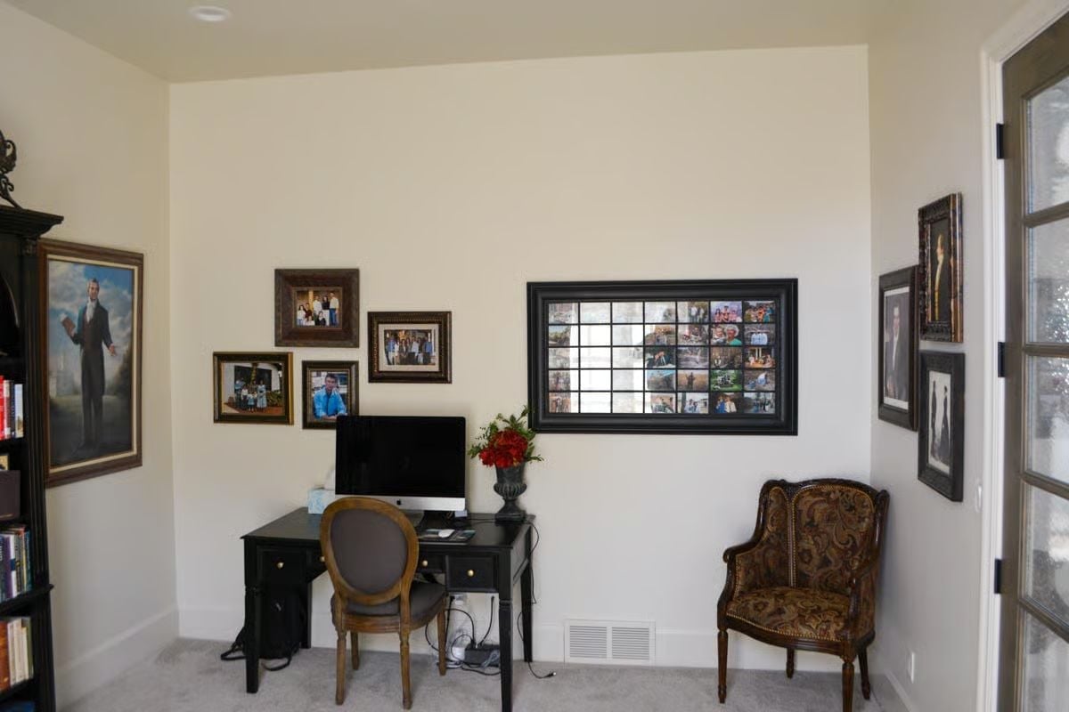 Portrait Gallery Wall Meets Black Lacquer Desk in a Home Office Worth Closing the Door For