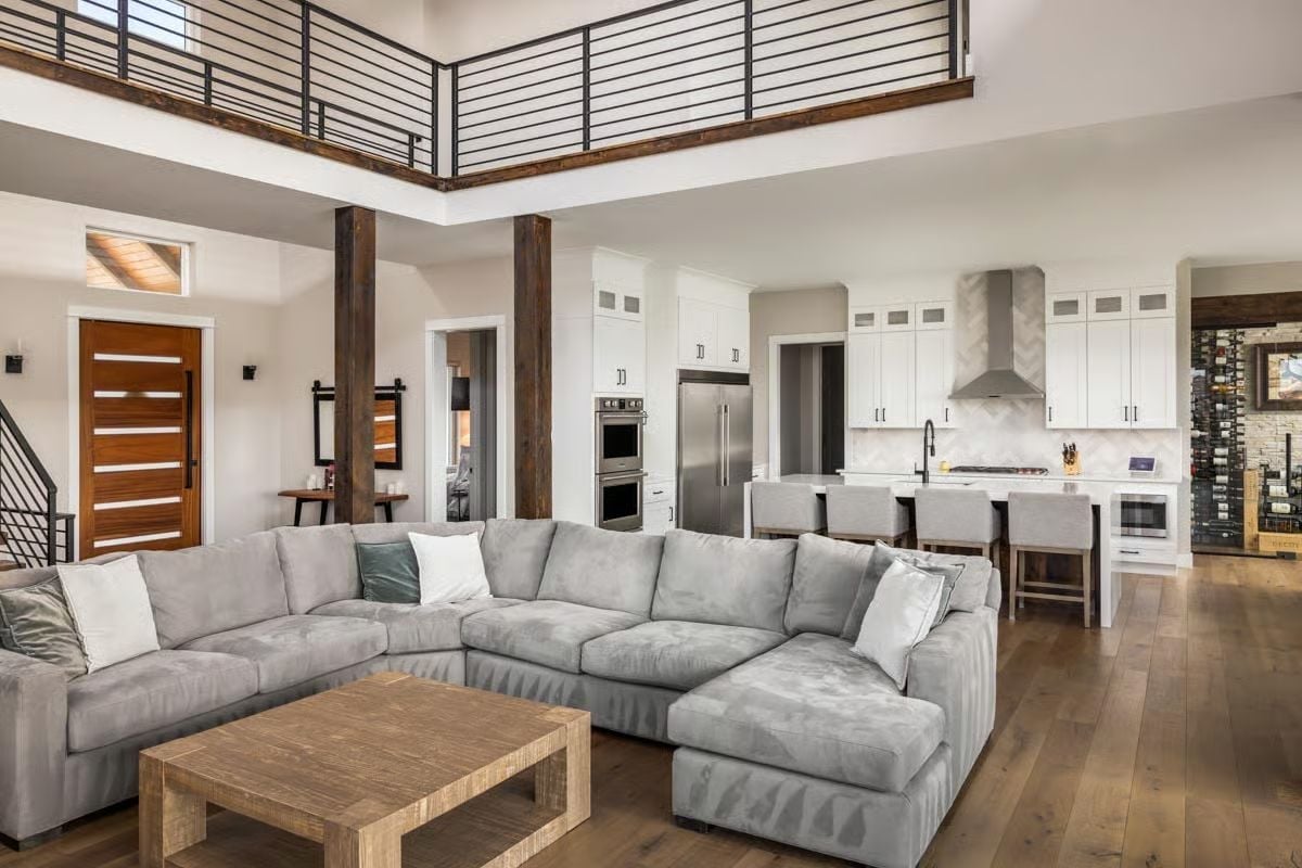Gray Sectional Big Enough to Mean It, Kitchen Open Behind It