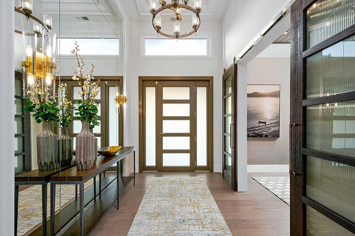 Frosted Glass Front Door and Barn Doors Make Quite the Entrance