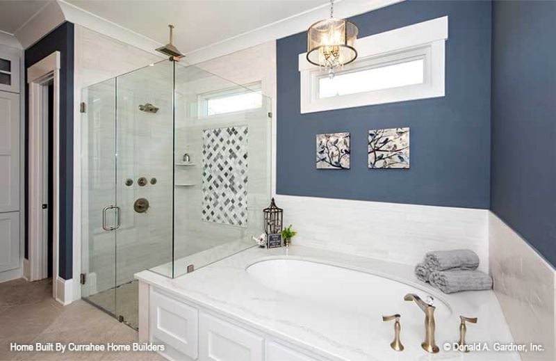 Navy Walls and a Soaking Tub That Make the Shower Feel Like an Afterthought