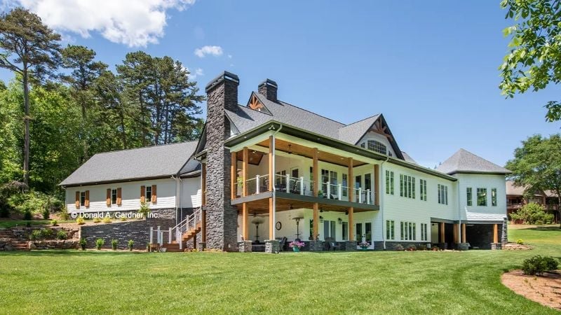 Stone Chimney, Double Porches, and a Lawn That Practically Dares You to Relax