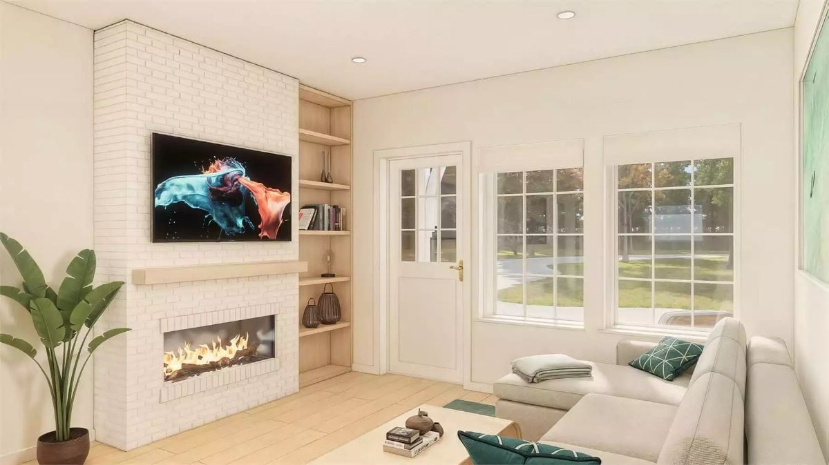 Whitewashed Brick and Built-Ins Make This Living Room Feel Like You Never Have to Leave