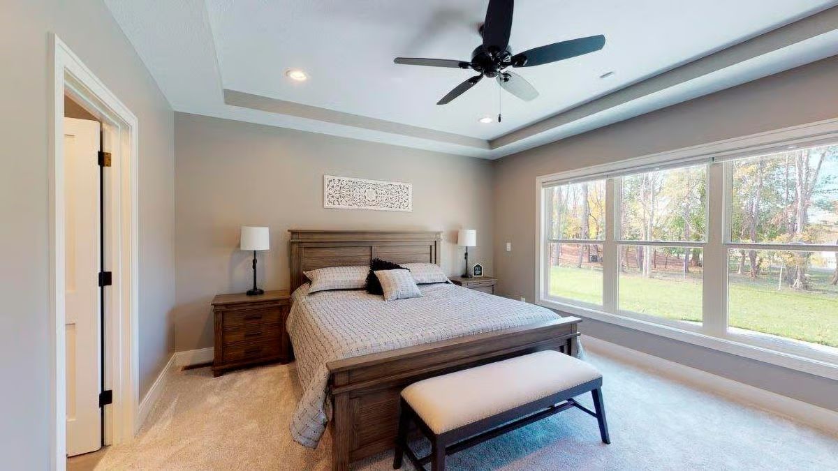 Tray Ceiling, Bench Footboard, and Windows That Pull the Yard Inside