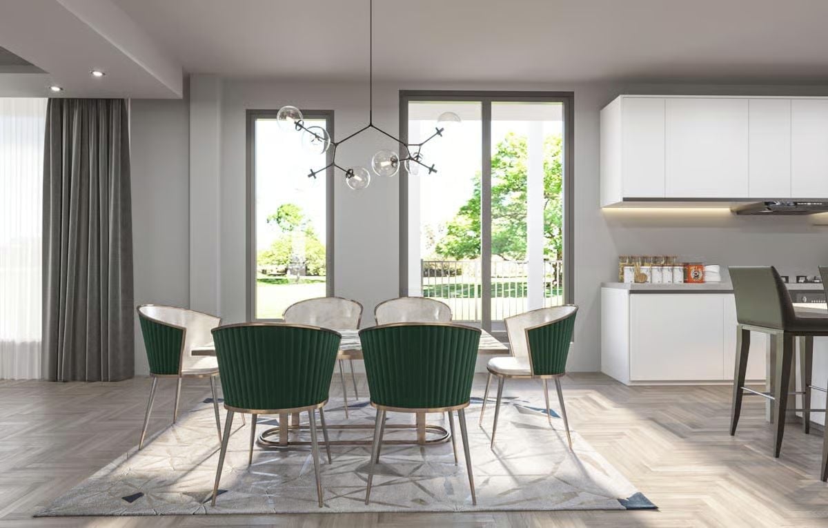 Green Velvet Chairs Against White Cabinetry Say Everything About This Dining Room's Priorities