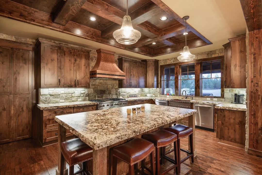 Copper Hood, Stone Backsplash, and a Granite Island Built for Actual Gatherings